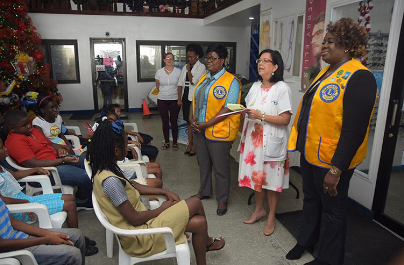 Dr. Michelle Ming speaks to the children on how to care their glasses.