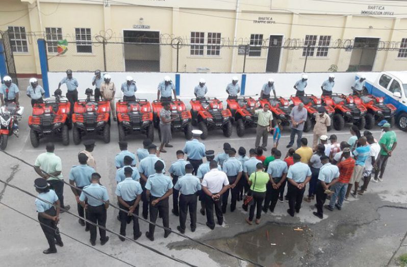 Ranks in prayer during the handing over of the vehicles at the Bartica Police Station