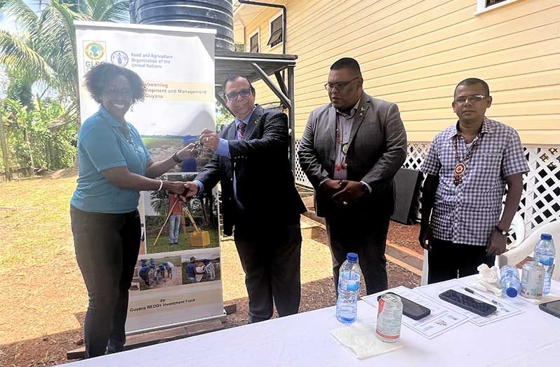 FAO Representative, Dr Gillian Smith, hands over keys of the renovated Mabaruma office to Mr. Enrique Monize, CEO of GLSC