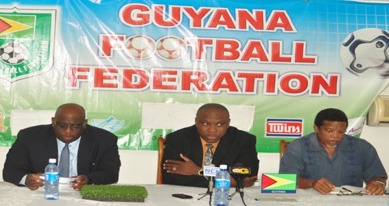 FIFA Development Officer Howard McIntosh (second from left) addresses the media at yesterday’s Press conference, flanked by GFF president Christopher Matthias and general secretary Noel Adonis.