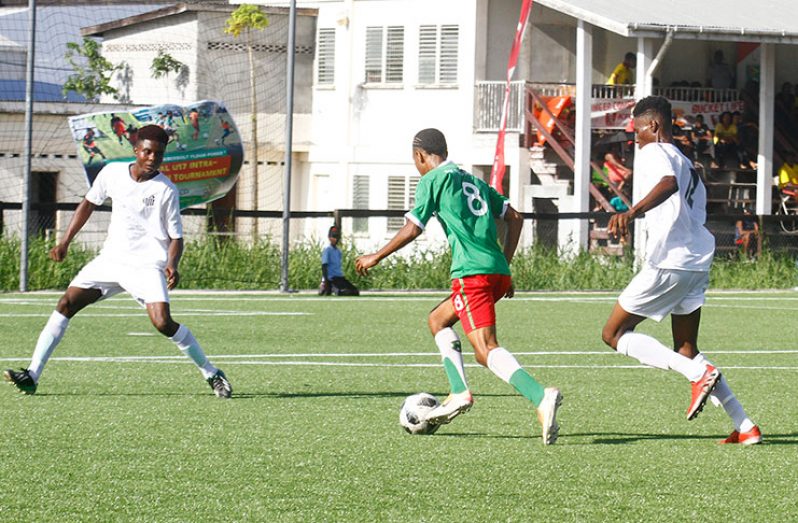 Dynamic FC’s John Gonsalves (No. 8) on the attack against Santos FC in the final of the GFF/KFC U-20 Independence Cup tournament at the GFF National Training Centre, Providence.