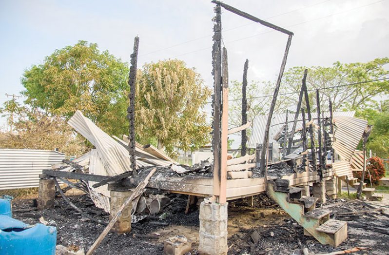 The remains of the house that was set ablaze (Samuel Maughn Photo)