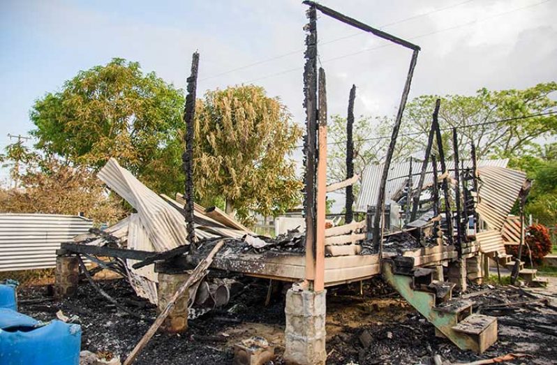 The remains of the house that was set ablaze. (Samuel Maughn Photo)