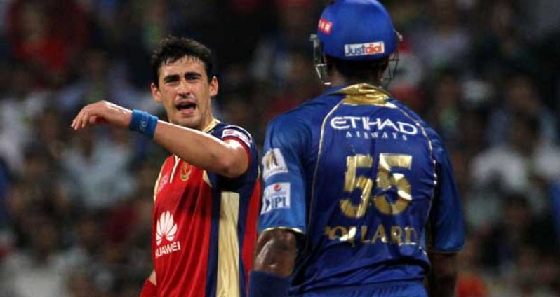 Mitchell Starc is not impressed after Kieron Pollard flings his bat towards him, in their showdown in Mumbai, yesterday