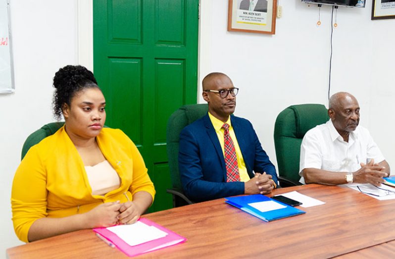 Seated from left at the Department of Labour are: Labour Officer, Latoya John; Consultant/Trainer at the Business Crisis Consultants, Garth Vincent and Minister within the Ministry of Social Protection, Keith Scott (Delano Williams photo)