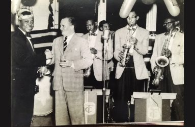 Tom Charles, left, being presented with an Award by Major Henwood of the BG Militia Band