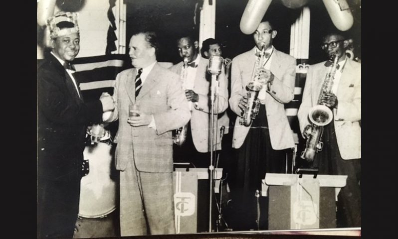 Tom Charles, left, being presented with an Award by Major Henwood of the BG Militia Band