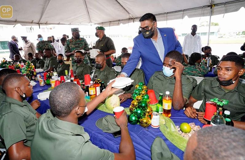 Commander-In-Chief of the Armed Forces, President Dr. Irfaan Ali,
serving lunch to members of the Guyana Defence Force during the
army’s annual Christmas Luncheon hosted at Base Camp Ayanganna,
Georgetown, on Wednesday (Office of the President photo)