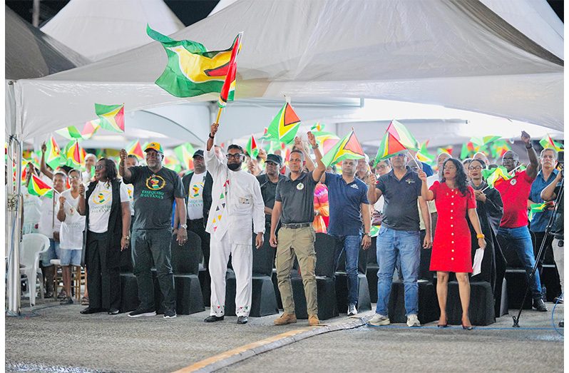 Commander-in-Chief of the Armed Forces and President of Guyana, Dr. Irfaan Ali (centre) is flanked by Prime Minister (Brigadier Ret’d Mark Phillips (second from left), Chief of Defence Staff Brigadier Omar Khan (third from right), cabinet members and others at the National Patriotic Concert, held at the Anna Regina Car Park, Essequibo Coast on Saturday evening (Photo: Jose Cheddi/Office of the President)