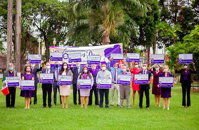 First Lady, Mrs. Arya Ali (front centre) and Minister of Human Services and Social Security, Dr. Vindhya Persaud (fourth left) are joined by a number of foreign diplomats as they all stand in solidarity with women on the occasion of International Women’s Day 2021 (Saajid Husani photo)