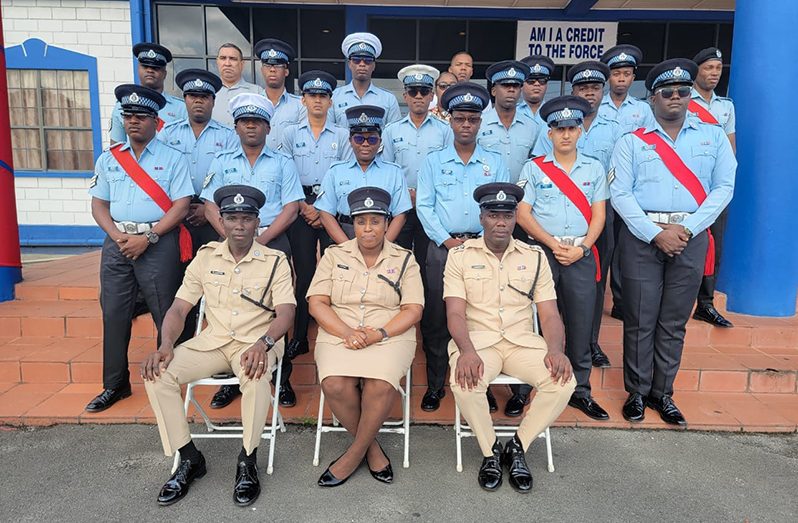 Force Training Officer, Woman Superintendent Sonia Herbert (seated at centre) flanked by other senior ranks (seated) with the ranks participating in the First Junior Leader course