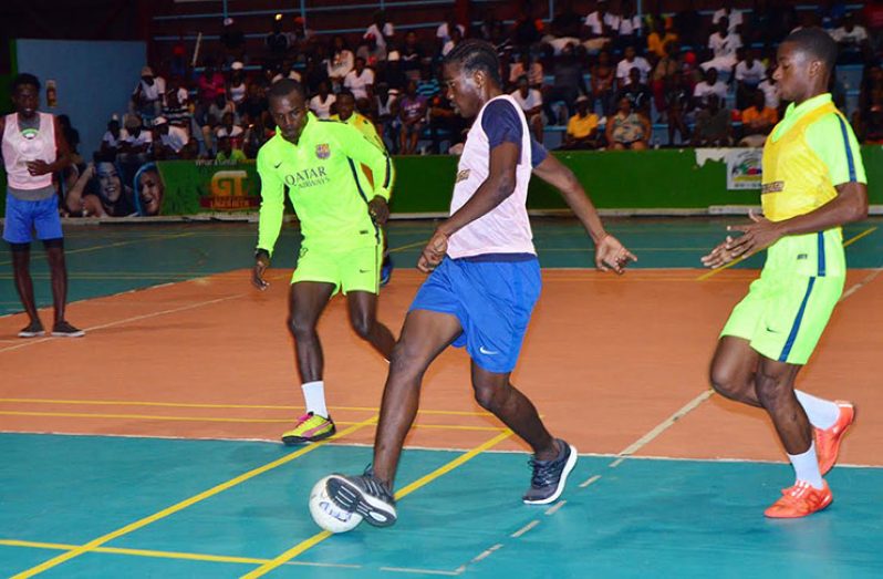 Part of the action on Thursday in the Xtreme Cleaners/GT Beer Gold Rush Futsal Championship at the National Gymnasium.