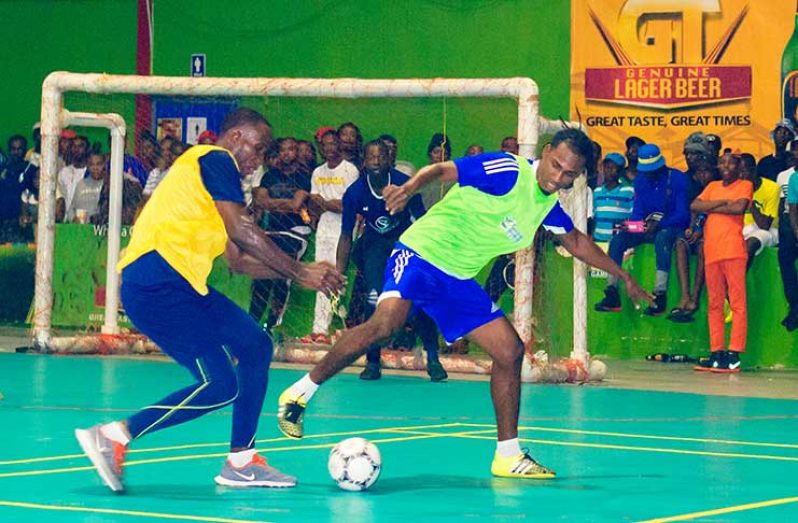 Action at the National Gymnasium at a recently held Futsal tournament. (Delano Williams photo)