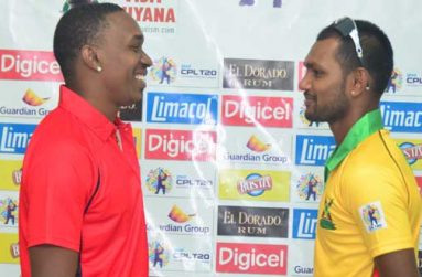 Friends today, Foes tonight! Guyana Amazon Warriors skipper Denesh Ramdin (right) faces up against his Red Steel counterpart, a smiling Dwayne Bravo, ahead of tonight’s important second round clash at the Guyana National Stadium, Providence. (Photo by Adrian Narine)