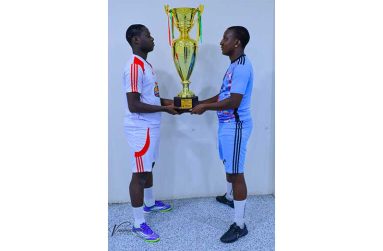 Faceoff! Captain of Bent St. Adrian Aaron (left) and skipper of Back Circle Stephon McLean pose with the championship trophy ahead of tonight’s final