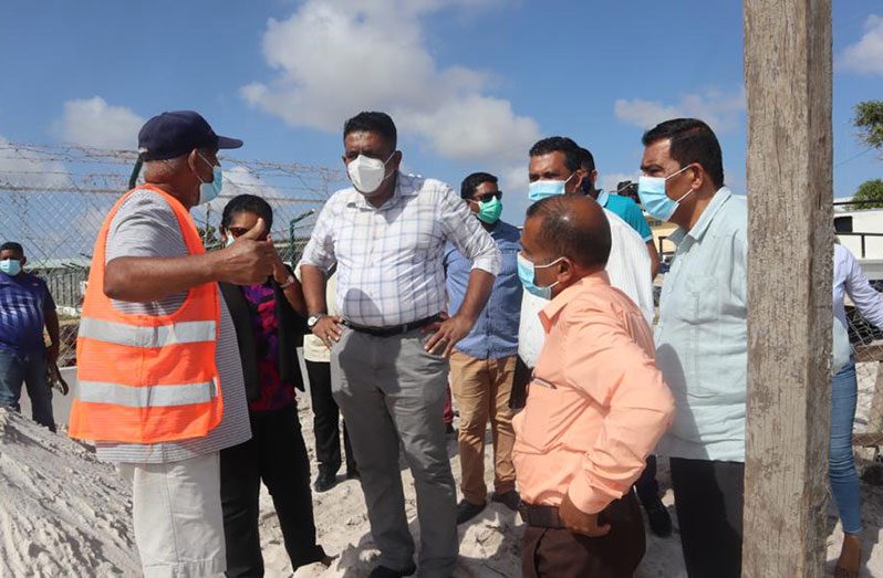 Agriculture Minister Zulfikar Mustapha interacts with the contractor and others at the construction site