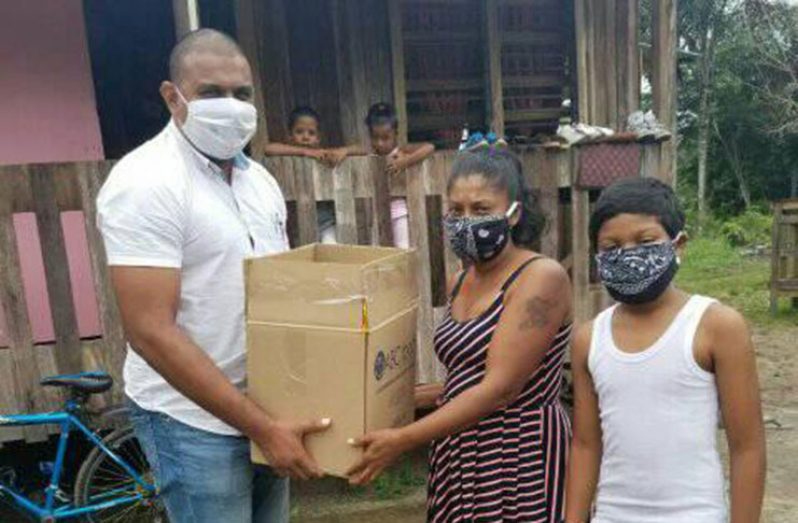 Some of the families that received packages of relief from Empower Guyana Consultancy