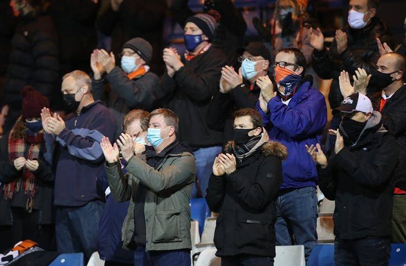 Fans must wear masks at EPL games, as Luton and Norwich supporters did at their Championship match.