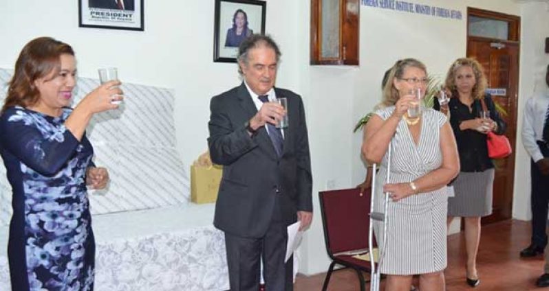 Foreign Minister, Ms. Carolyn Rodrigues-Birkett, shares a farewell toast with Ambassador Luiz Gilberto Seixas de Andrade and his wife