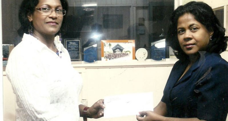 Ms Annie Joao (right) of Farfan and Mendes, proudly hands over the sponsorship cheque to a smiling Sylvia Foster.