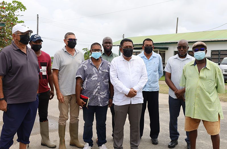 Agriculture Minister, Zulfikar Mustapha, along with some of the farmers benefitting from the pilot project. Also pictured are other officials from the ministry (Ministry of Agriculture photo)