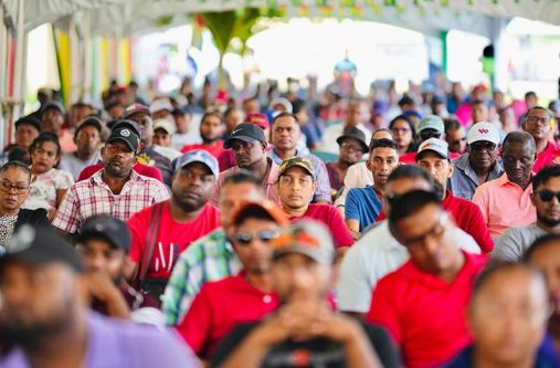 Rice farmers and residents at the launch of a landmark crop insurance programme at the Anna Regina Secondary School on Tuesday