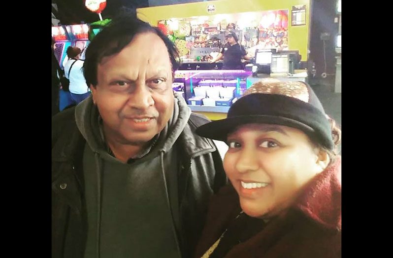 Ebony and her dad, Vivekanand Narpatty Brijbassi, at a Movie Theatre in Canada