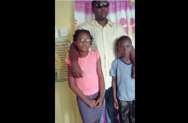 Oliver Kerr with his two children