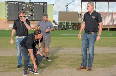 CPL Chief Operations Officer Pete Russel examines the pitch at national stadium in the presence of CPL International Director of Cricket Tom Moody, CPL and other CPL officials. Guyana will host four matches beginning tomorrow. (Samuel Maughn photo)