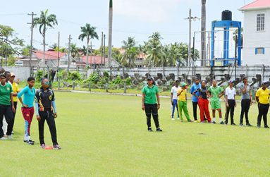 Assistant coach/manager, Devita Gobin (centre) is seen with national female Under-19 cricket squad as they are about to commence training yesterday at the Georgetown Cricket Club (GCC) ground.