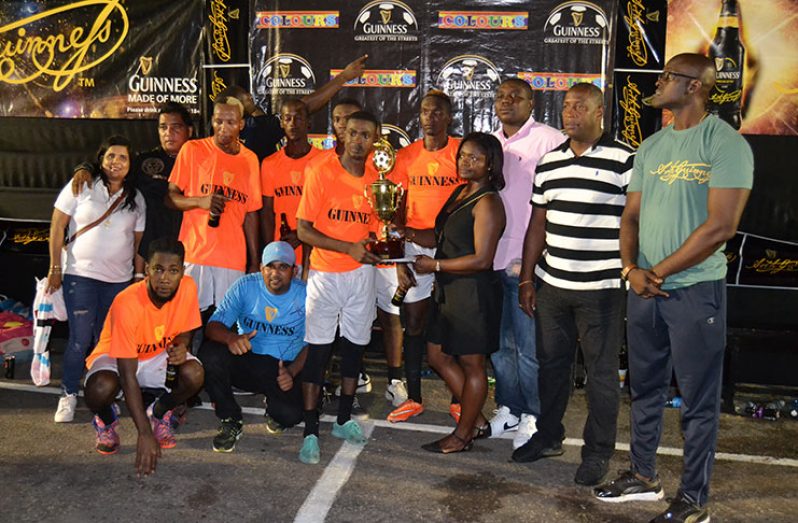 Champions! Dave and Celina’s All-star collect their trophy from the Banks DIH and Guinness executives.