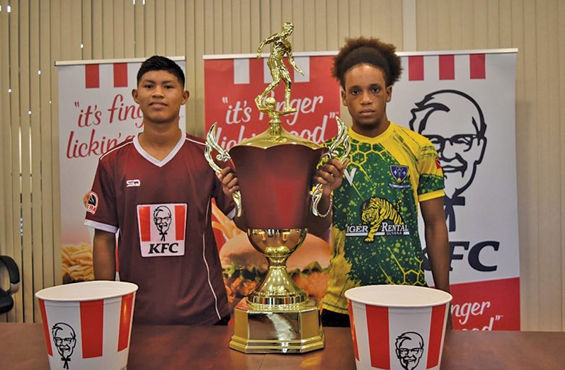 Captain of Waramadong, Raydon Krammer (left) and St Benedict’s captain Cunnielus Hannaway with the prized trophy ahead of today’s clash