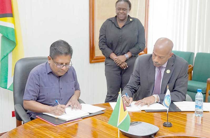 Senior Minister in the Office of the President with Responsibility for Finance and the Public Service, Dr. Ashni Singh and Chief Executive