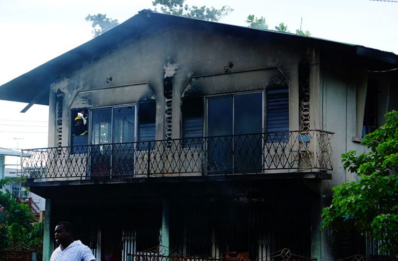 What remains of the two-storeyed house after the fire
