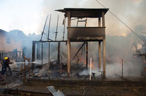Firefighters attempt to quell the fire which destroyed the 151 Cato Street, Agricola house