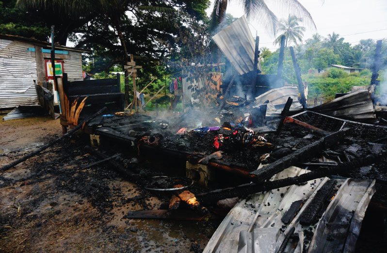 The Charred remains of the house.