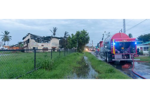 : According to sources at the scene, emergency services were alerted by people living nearby to the fire around 5:30.pm. Three fire trucks, two from the Guyana Fire Service Headquarters and one from the West Ruimveldt station, responded to the call (Japheth Savory photo)