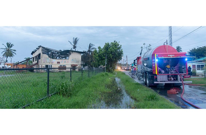 : According to sources at the scene, emergency services were alerted by people living nearby to the fire around 5:30.pm. Three fire trucks, two from the Guyana Fire Service Headquarters and one from the West Ruimveldt station, responded to the call (Japheth Savory photo)