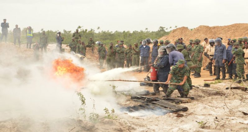 Members of the Joint Services demonstrating their firefighting skills during the training (GDF photo)