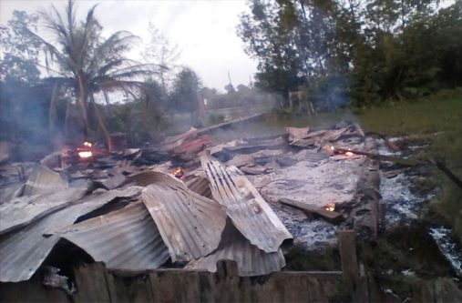 The smoldering remains of the house