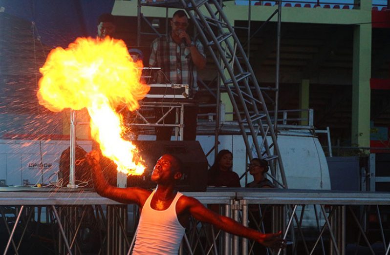 An entertainer produces a ‘blaze’ at the launch of GTT’s high-speed Internet services at the Guyana National Stadium, Providence, East
Bank Demerara (Ravin Singh photo)