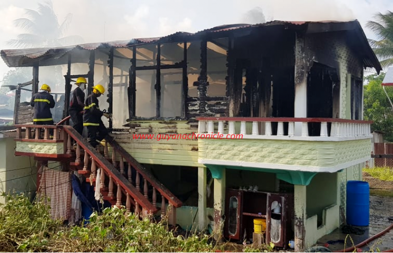 Firemen as they controlled the blaze at the scene.