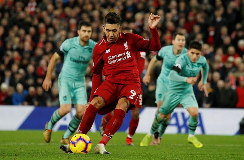 Liverpool's Roberto Firmino scores their fifth goal from the penalty spot to complete his hat-trick. (REUTERS/Phil Noble)
