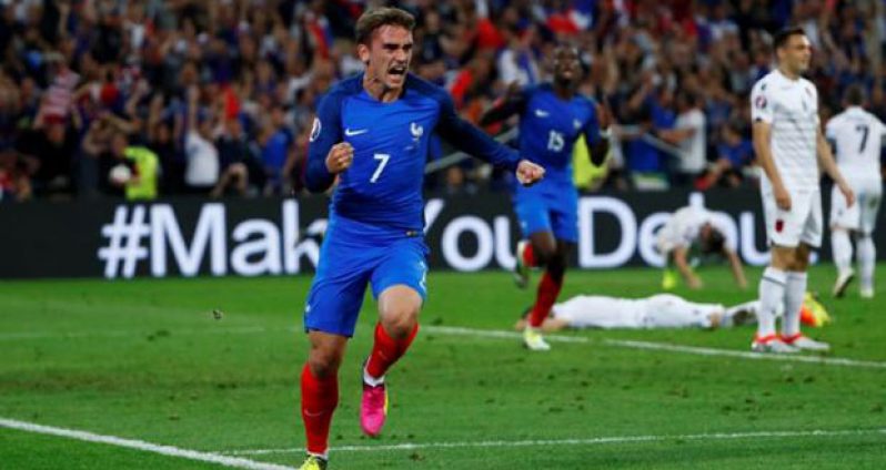 France's Antoine Griezmann celebrates after scoring their first goal. (Reuters/Eddie Keogh)