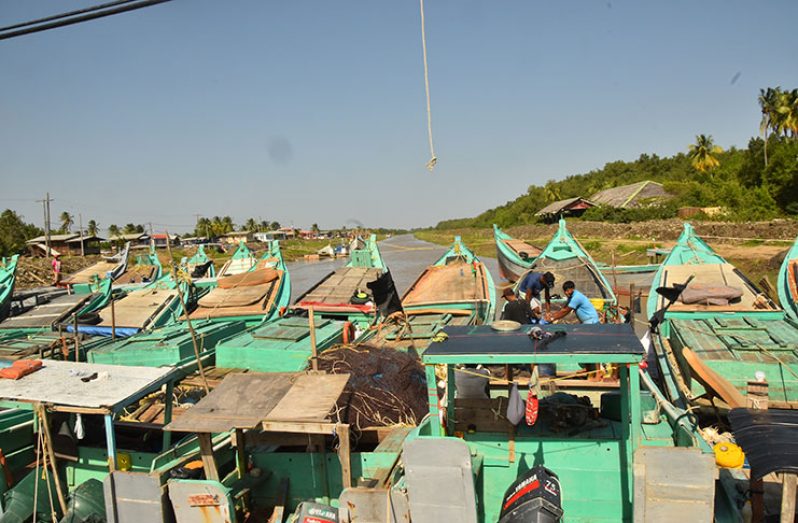 Fishermen await the high tide in order to get out at sea (Photos by Adrian Narine)