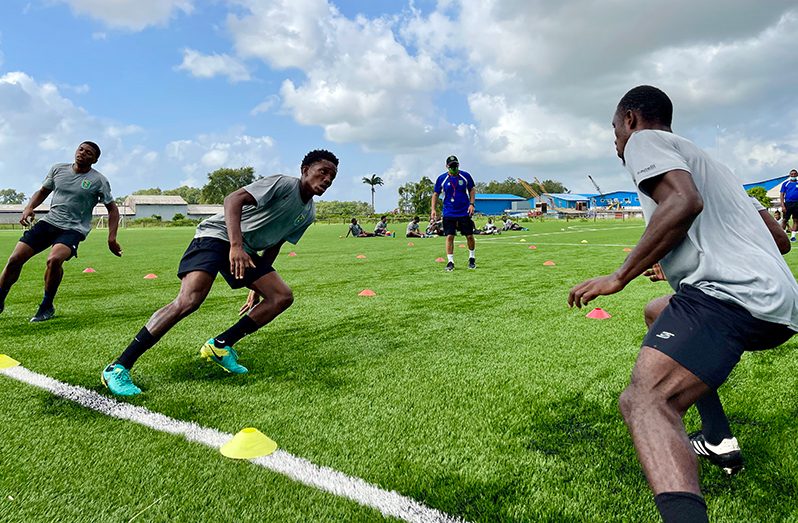 Golden Jaguars fitness coach Wilson Toledo guiding players through their fitness evaluation over the weekend at the GFF’s National Training Centre at Providence.