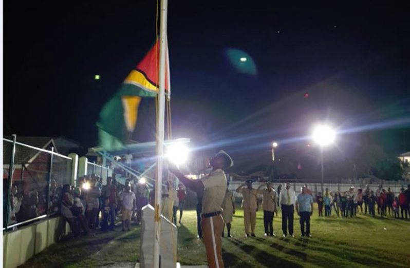 The Golden Arrowhead being hoisted at midnight