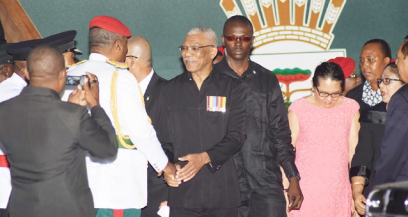 ‘Job well done!’ President David Granger seems to be saying as he greets Chief-of-Staff of the Guyana Defence Force (GDF) Brigadier Mark Phillips after the formalities. First, second and fourth right are Prime Minister Moses Nagamootoo, his wife, Mrs Sita Nagamootoo, and First Lady, Mrs Sandra Granger