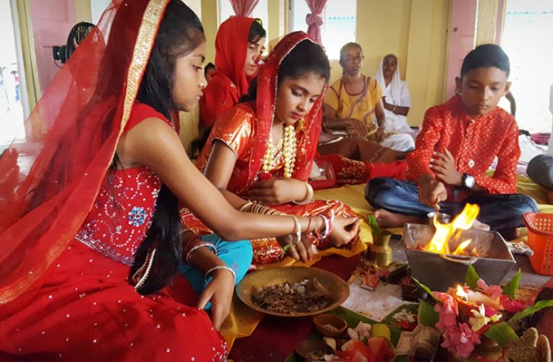 Children performing Lakshmi puja on Tuesday morning at the Golden Fleece Vishwa Jhotir