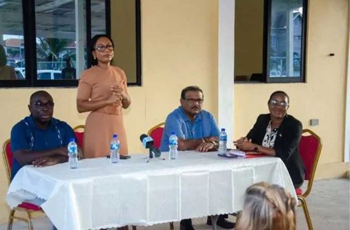 Minister of Tourism, Industry, and Commerce, Oneidge Walrond, flanked by Minister within the Office of the Prime Minister with responsibility for Public Affairs, Kwame McCoy, and Minister within the Ministry of Local Government and Regional Development, Anand Persaud speaks to the residents during the outreach